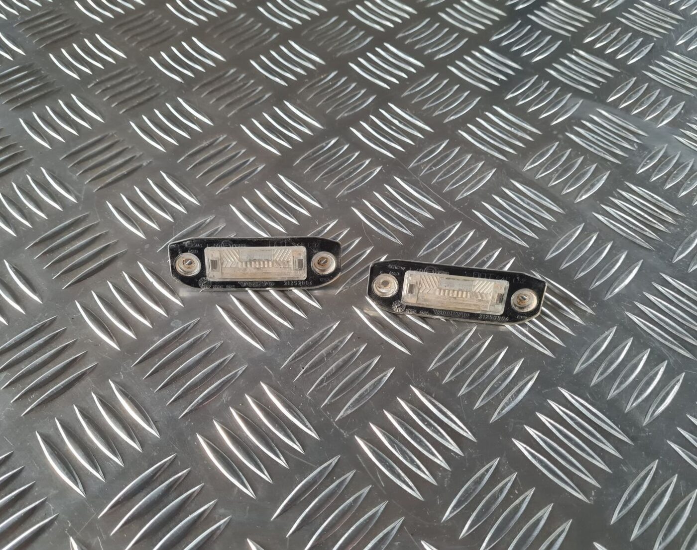 Numura zīmes apgaismojums priekš VOLVO S80 2007 Black 1 Numura zīmes apgaismojums priekš VOLVO S80 2007 Black